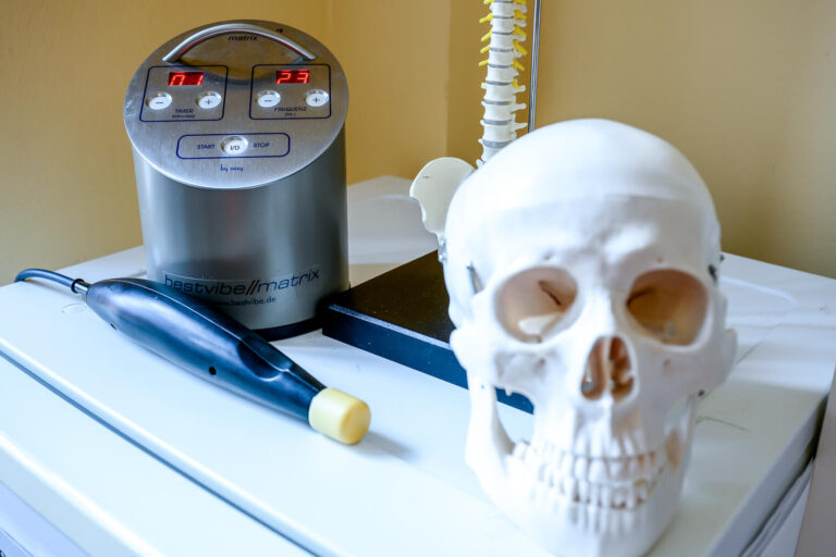 a skull and a device on a table